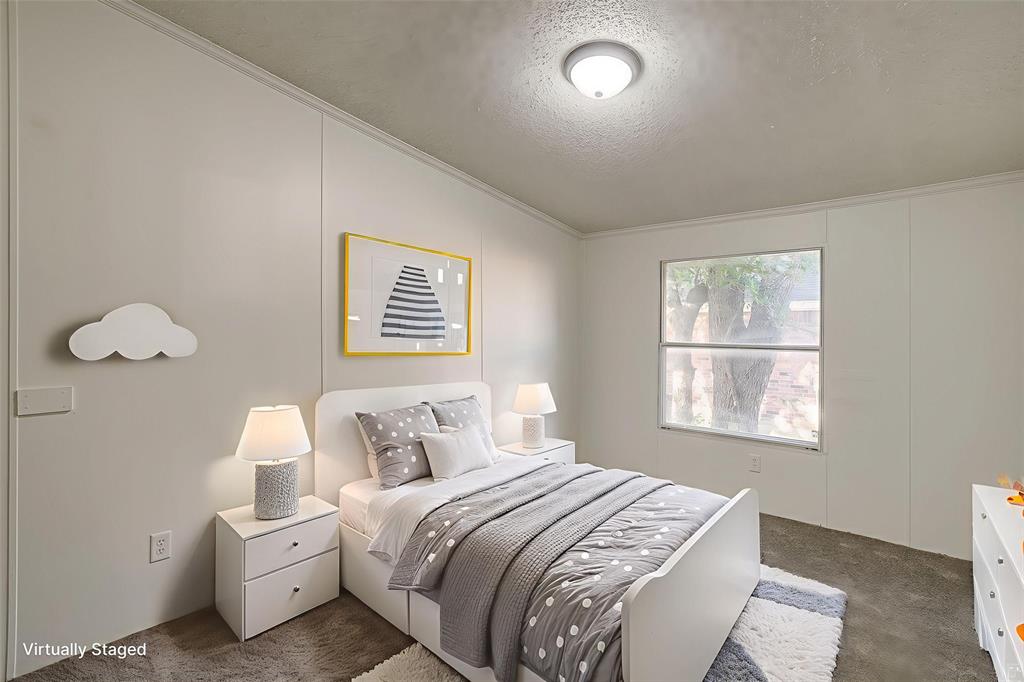 317 6th Street Joshua, TX 76058 - Photo 27 of 36 a bedroom with a bed and a window