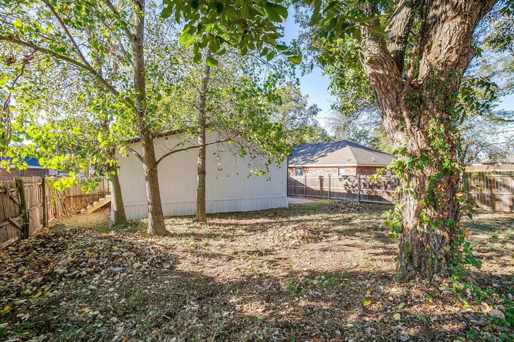 317 6th Street Joshua, TX 76058 - Photo 36 of 36 a view of a house with a tree