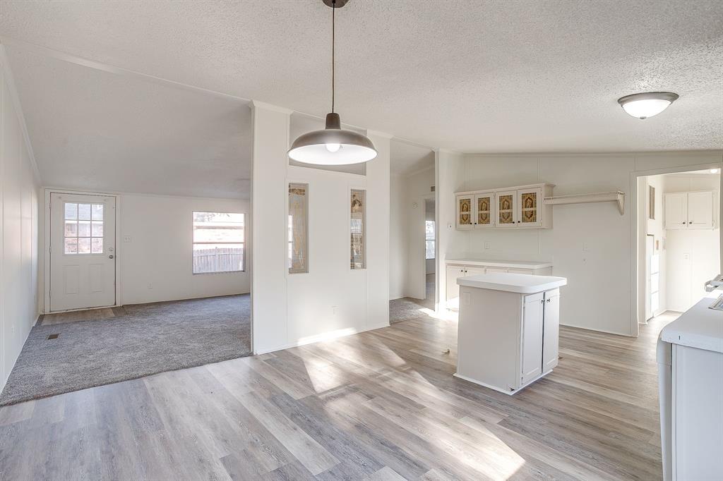 317 6th Street Joshua, TX 76058 - Photo 10 of 36 a view of empty room with wooden floor and fan