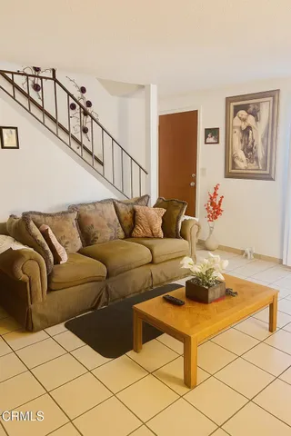 a living room with furniture and a couch