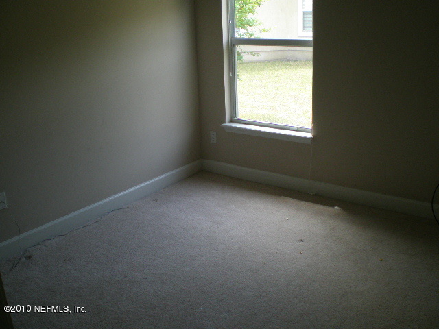 415 Emslie Terrace St. Augustine, FL 32095 - Photo 10 of 13 a view of an empty room with a window