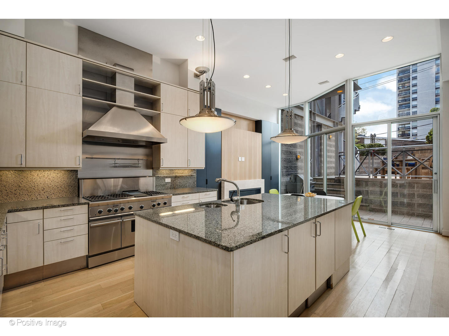 1434 North Dearborn Street Chicago, IL 60610 - Photo 17 of 67 a kitchen with stainless steel appliances granite countertop a sink a stove and a wooden floors