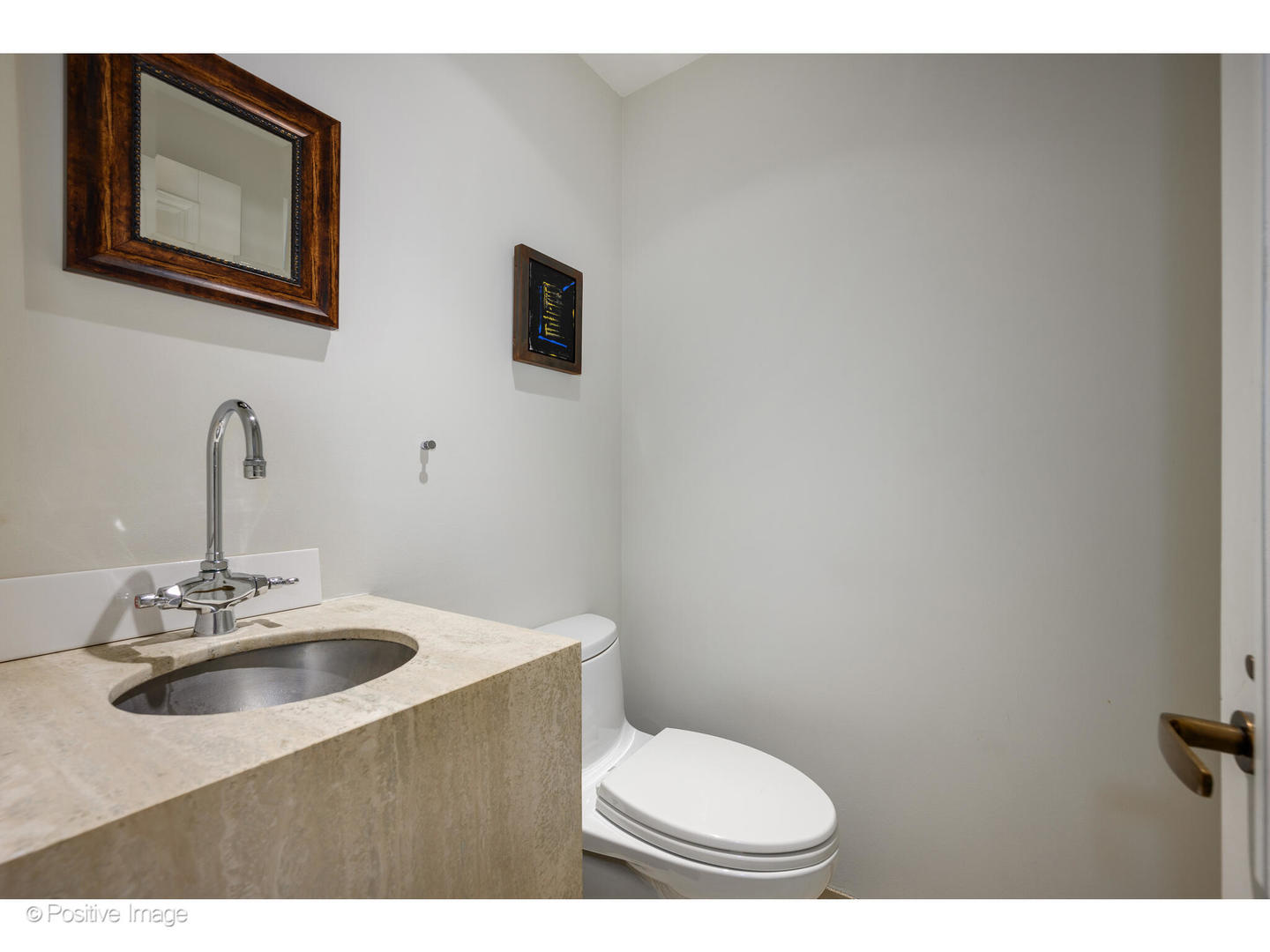 1434 North Dearborn Street Chicago, IL 60610 - Photo 25 of 67 a bathroom with a toilet a sink and mirror