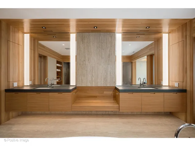 a bathroom with a sink double vanity granite and a