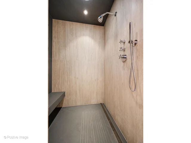 a view of an empty room with glass door