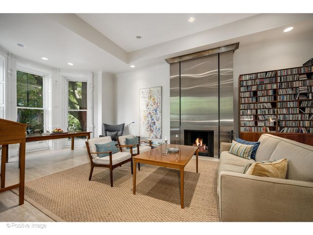 a workspace with furniture fire place and a fireplace