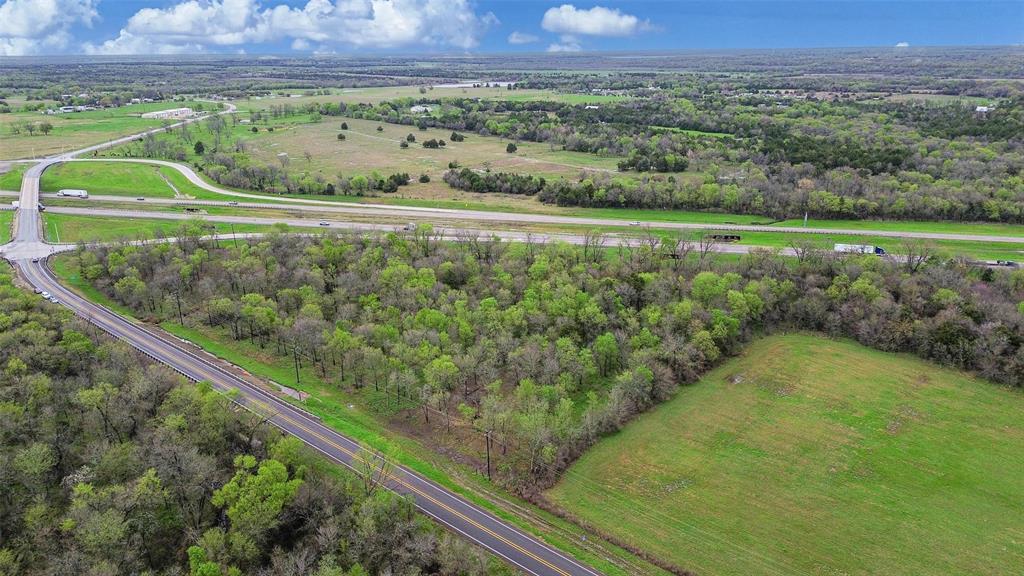 429 St Terrell Tx 75161 Terrell, TX 75161 - Photo 3 of 13 a view of a green field with an outdoor space