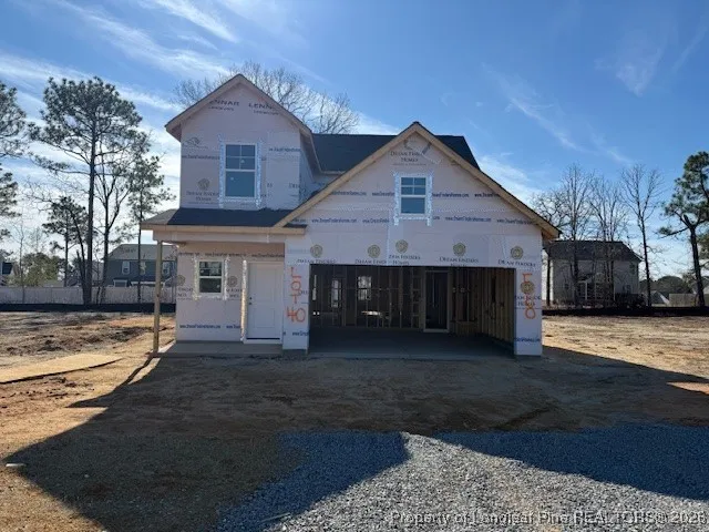 a view of front of house with a yard