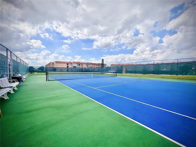 a view of an outdoor space and tennis court