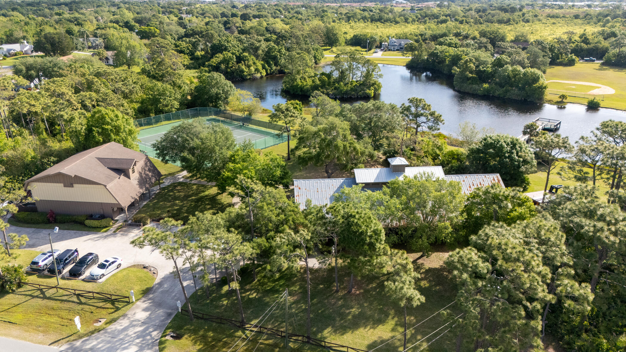 4179 Sparrow Hawk Road Melbourne, FL 32934 - Photo 12 of 26 an aerial view of a house with a yard and lake view