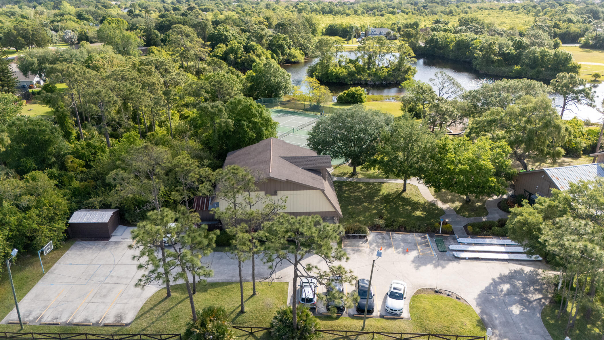 4179 Sparrow Hawk Road Melbourne, FL 32934 - Photo 13 of 26 an aerial view of a house with yard swimming pool and outdoor seating