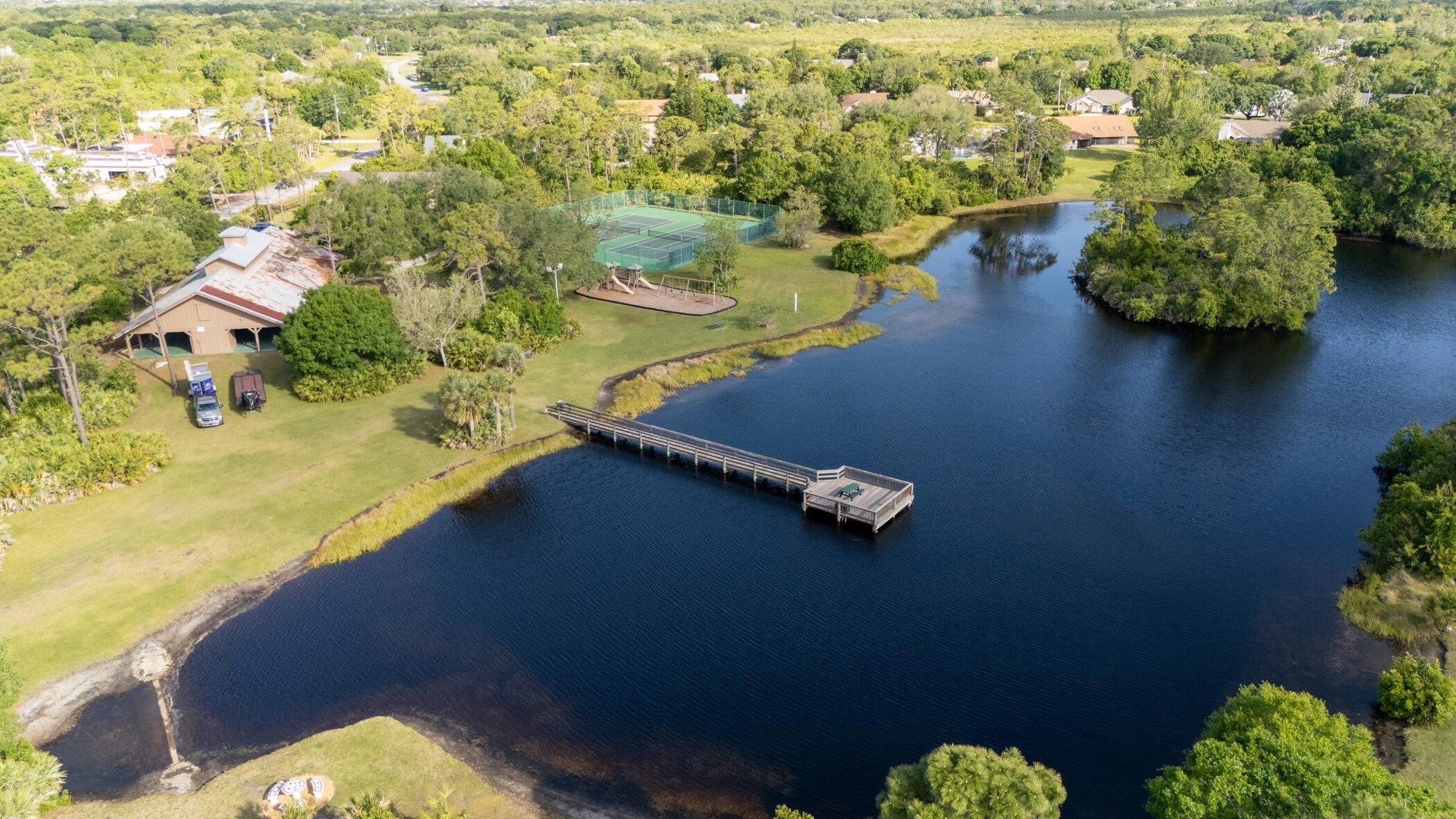 4179 Sparrow Hawk Road Melbourne, FL 32934 - Photo 16 of 26 an aerial view of residential houses with outdoor space