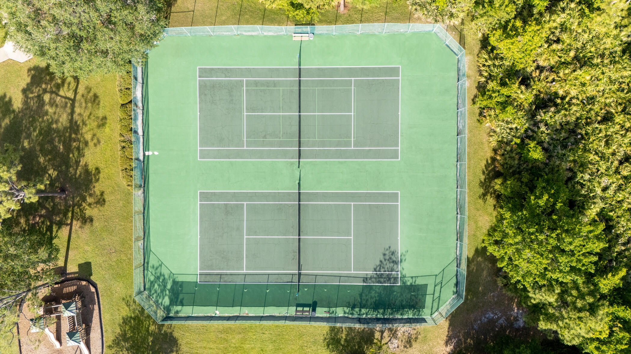 4179 Sparrow Hawk Road Melbourne, FL 32934 - Photo 19 of 26 a view of a house with a yard and potted plants