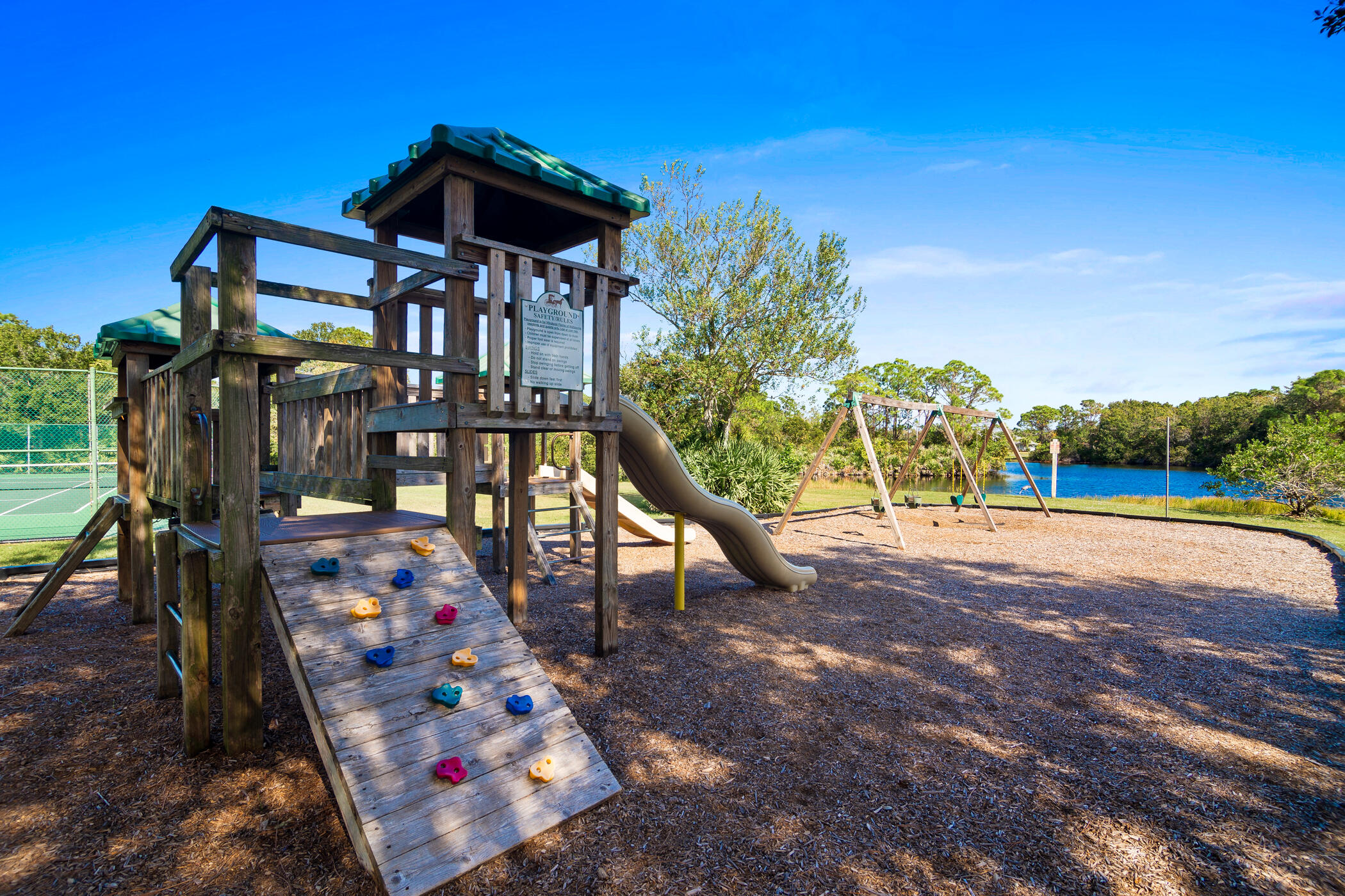 4179 Sparrow Hawk Road Melbourne, FL 32934 - Photo 20 of 26 a view of an chairs and umbrellas on the yard