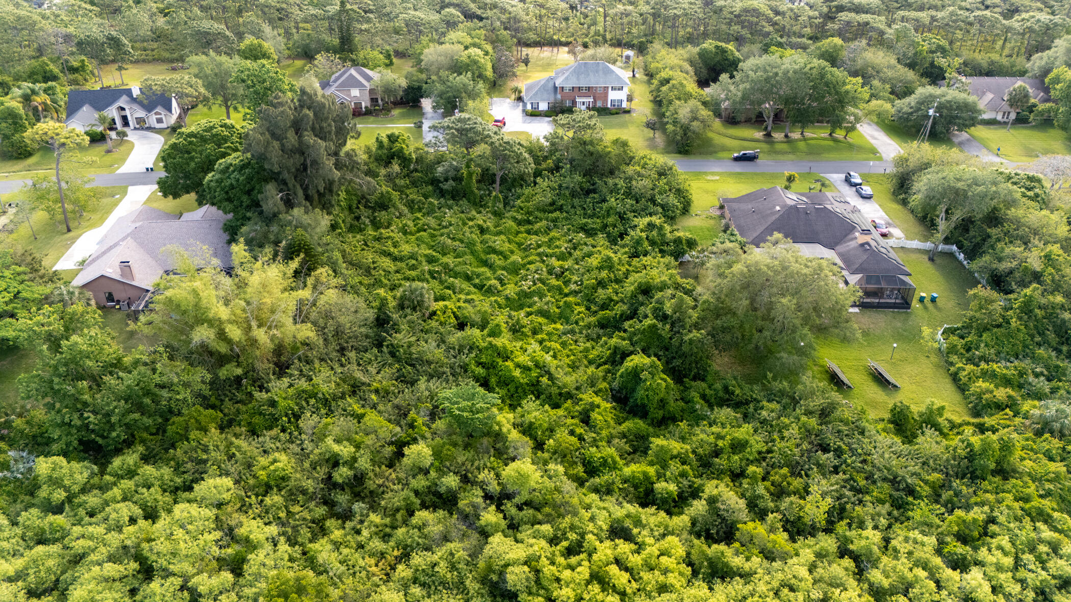 4179 Sparrow Hawk Road Melbourne, FL 32934 - Photo 7 of 26 an aerial view of residential houses with outdoor space and trees