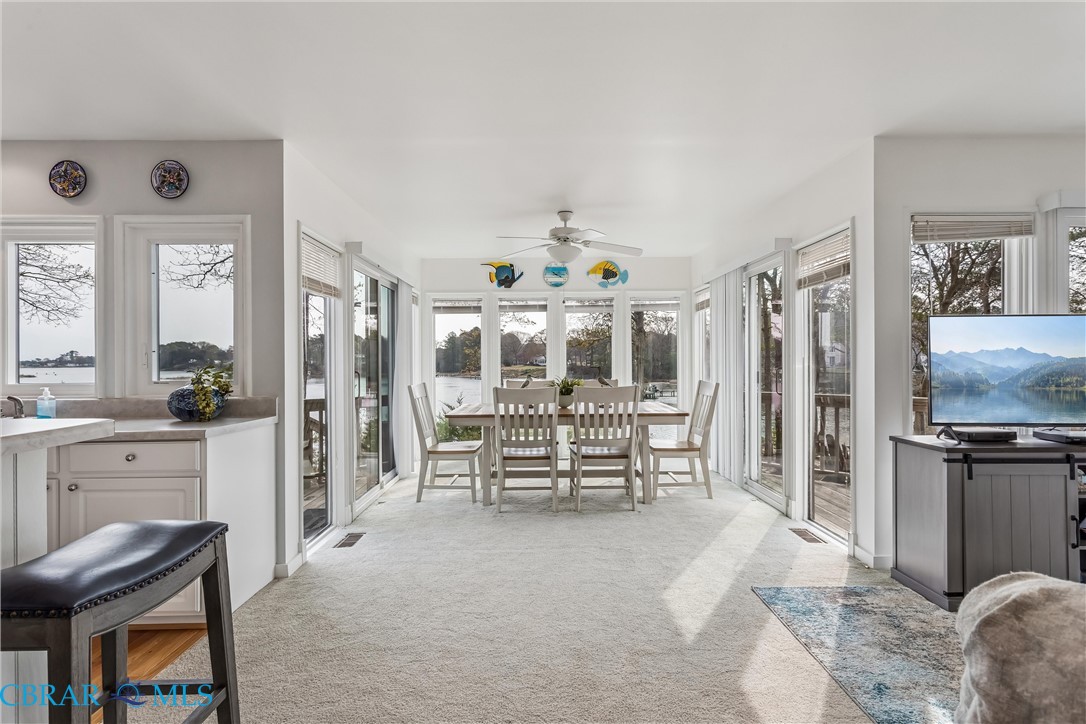 172 Sturgeon Creek Road Deltaville, VA 23043 - Photo 3 of 50 Sunroom featuring carpet floors and healthy amount of natural light