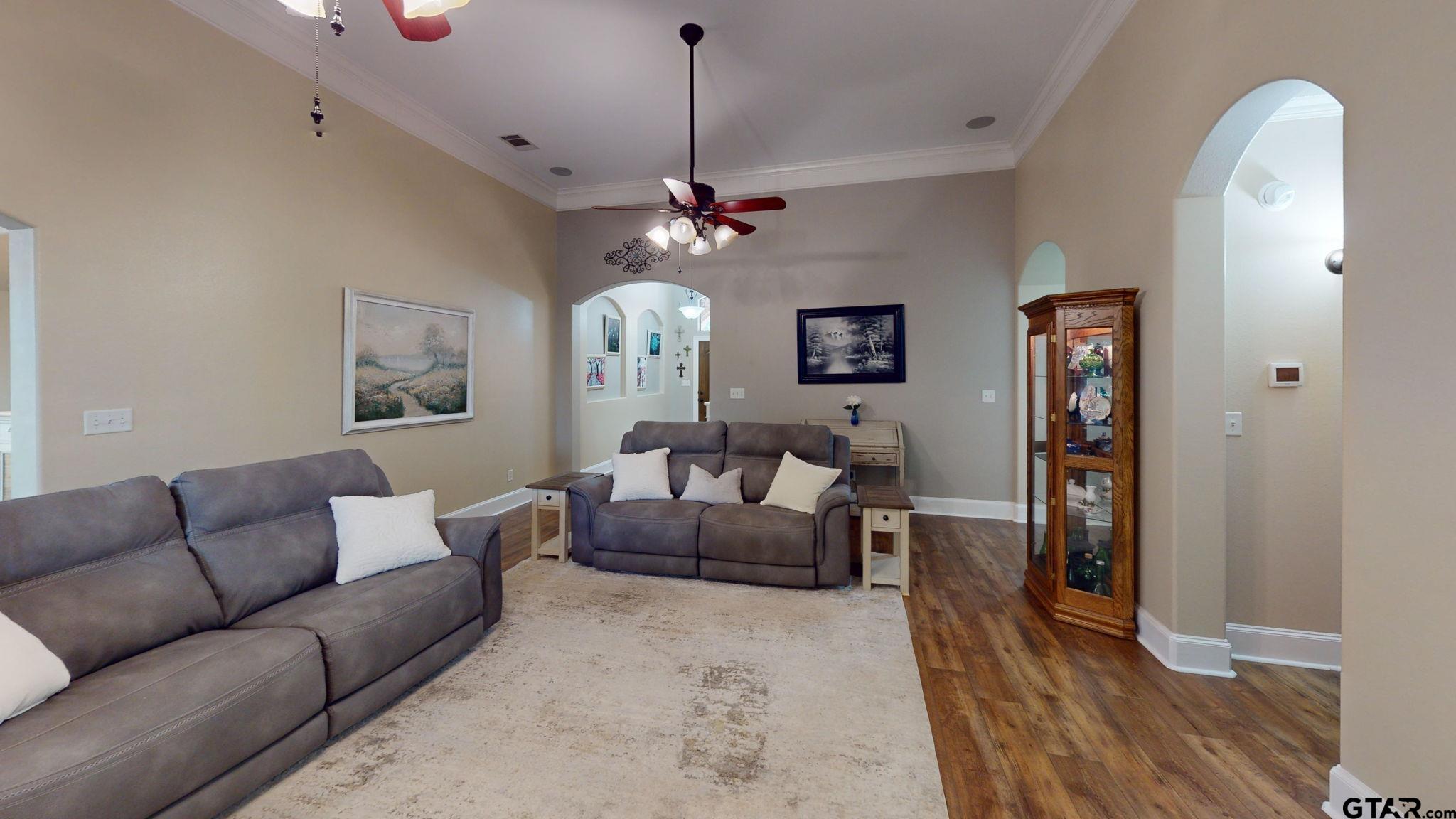 18488 Bluebird Circle Flint, TX 75762 - Photo 6 of 47 a living room with furniture a chandelier and a wooden floor