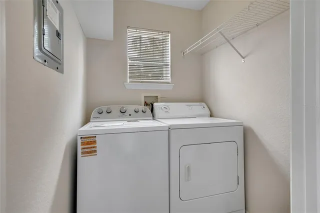 a utility room with dryer and washer