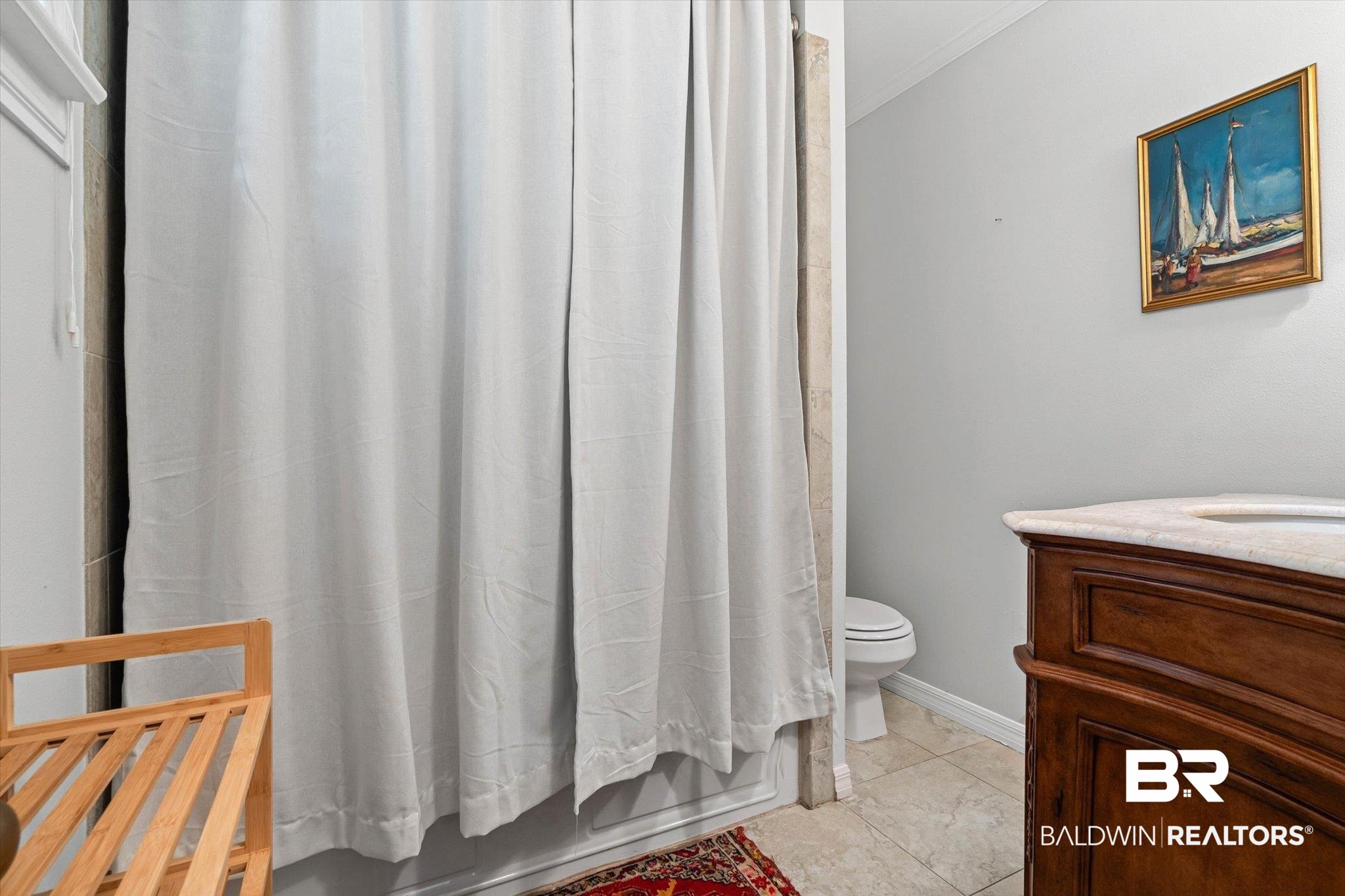 313 Brawood Drive Mobile, AL 36608 - Photo 20 of 32 Bathroom with vanity, light tile patterned flooring, shower / bathtub combination with curtain, and ornamental molding