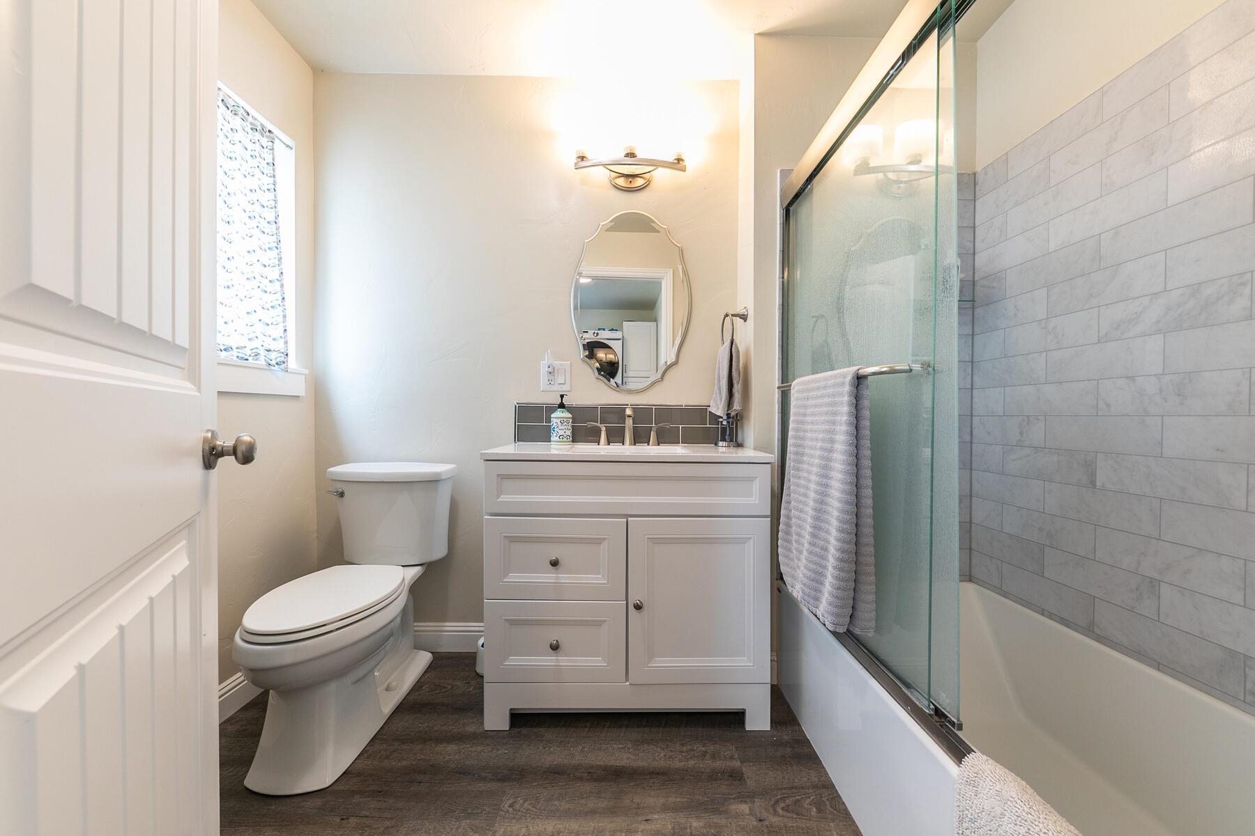 94101 Highway 70 Chilcoot, CA 96105 - Photo 18 of 20 a bathroom with a toilet a sink and a bathtub