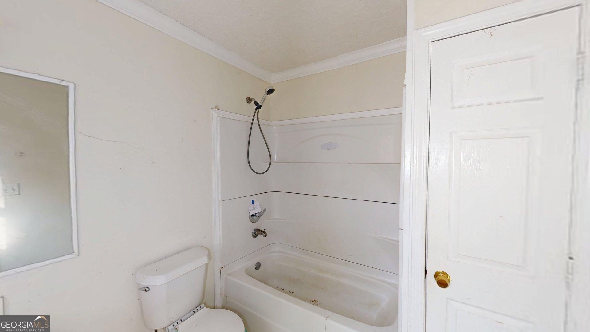 1225 Coppermine Road Buchanan, GA 30113 - Photo 14 of 29 a bathroom with a granite countertop shower and a toilet