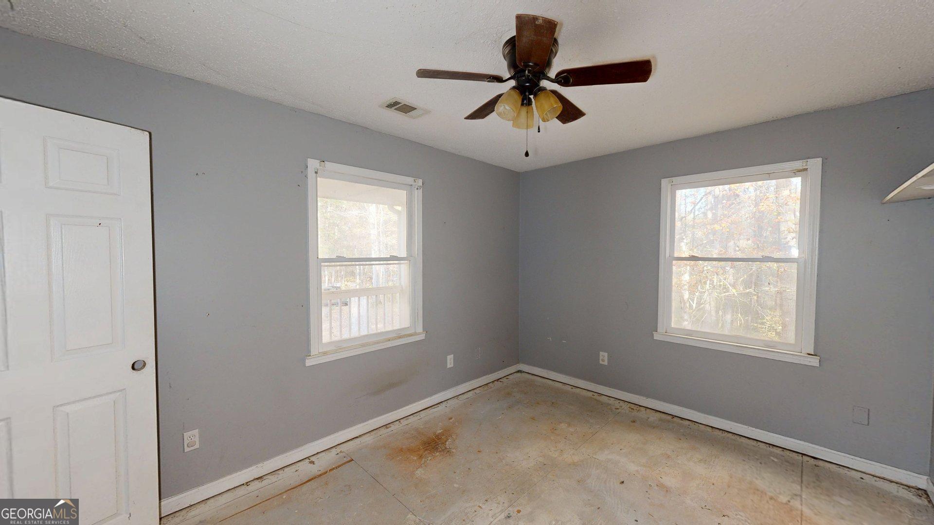 1225 Coppermine Road Buchanan, GA 30113 - Photo 16 of 29 an empty room with windows