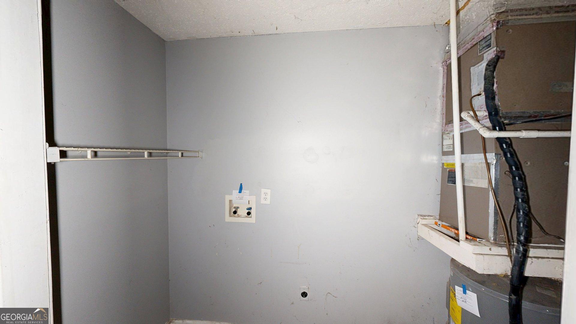 1225 Coppermine Road Buchanan, GA 30113 - Photo 22 of 29 a view of walk in closet with clothes