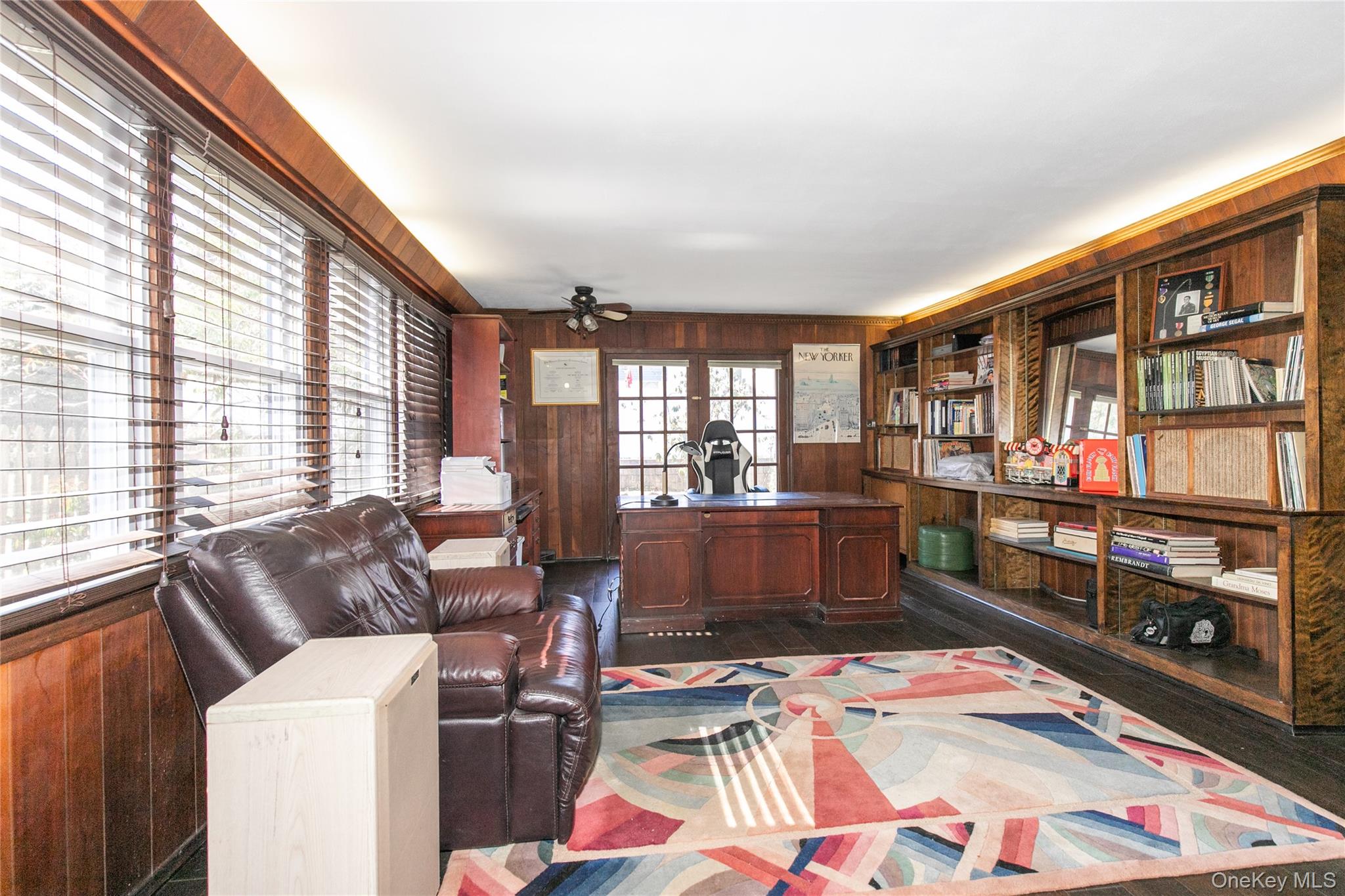 8 Plymouth Road Great Neck, NY 11023 - Photo 12 of 25 a bed room with furniture and a window
