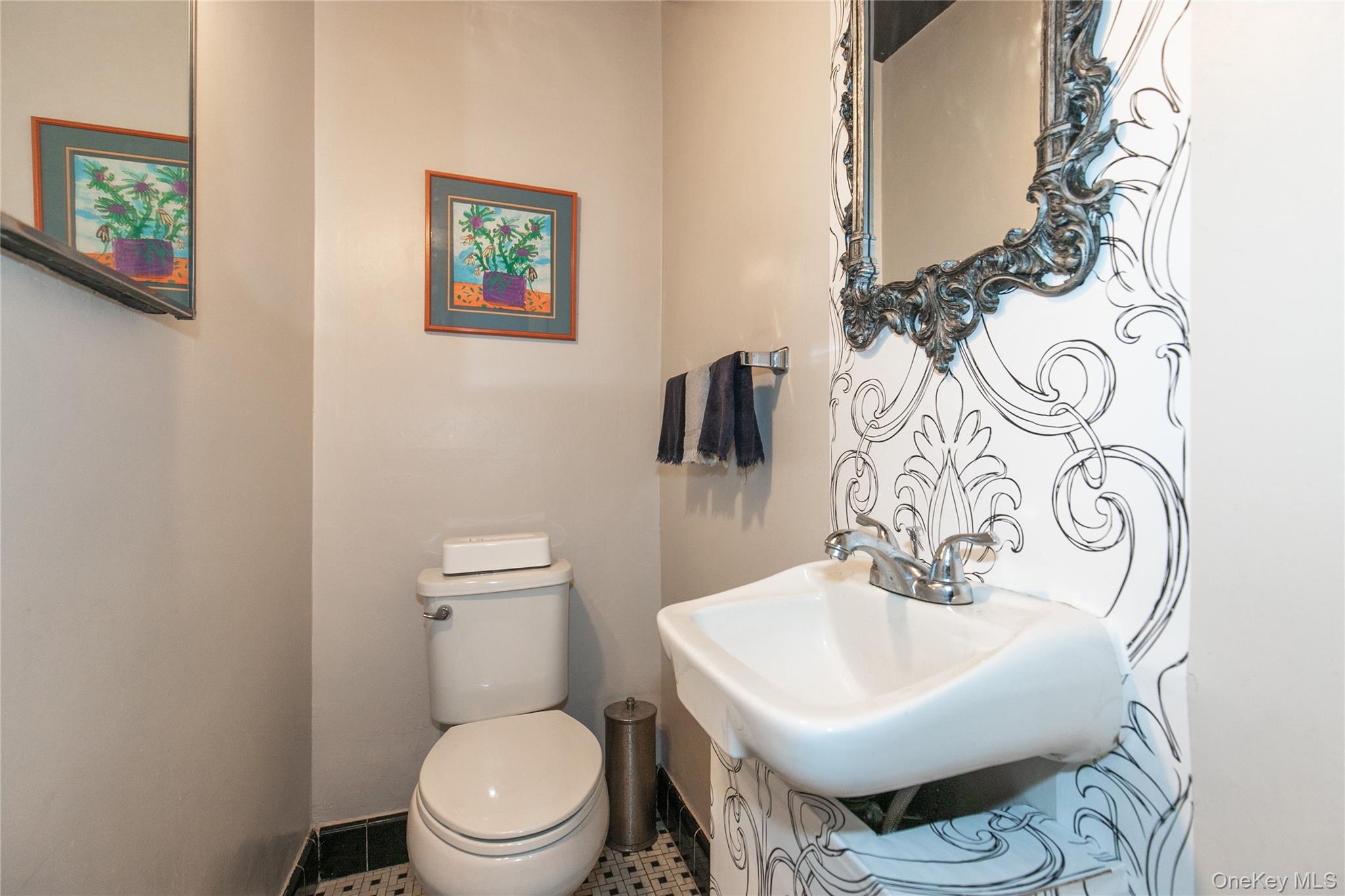 8 Plymouth Road Great Neck, NY 11023 - Photo 13 of 25 a white toilet sitting next to a white sink