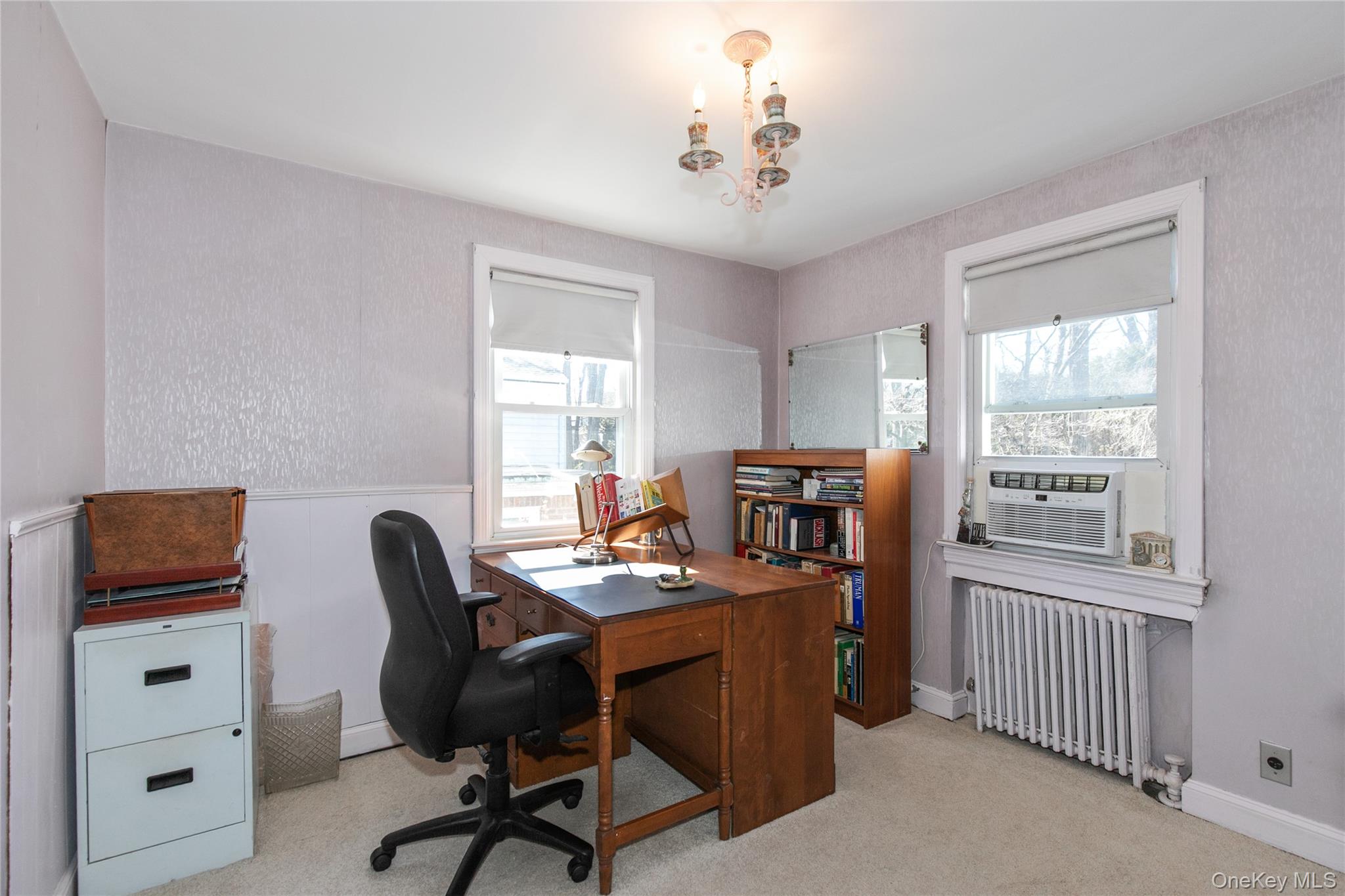 8 Plymouth Road Great Neck, NY 11023 - Photo 19 of 25 a view of a workspace with furniture and a window