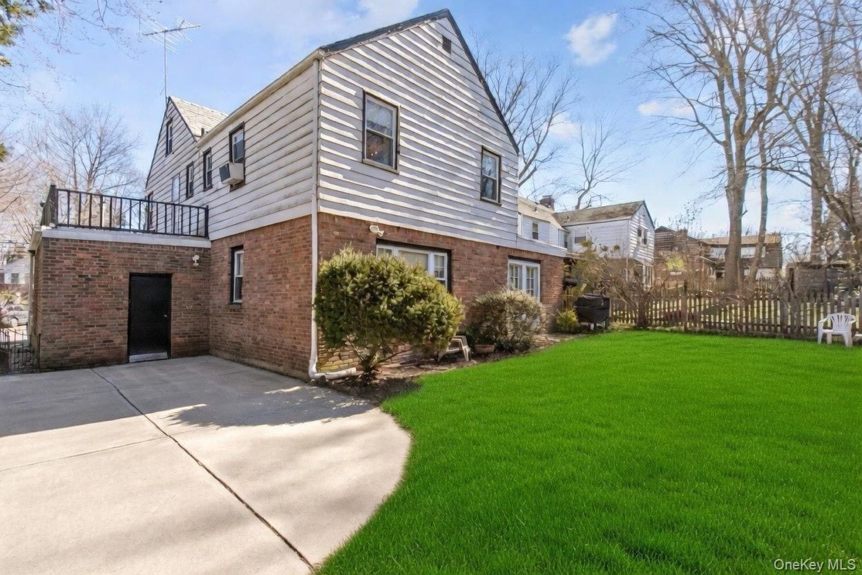 8 Plymouth Road Great Neck, NY 11023 - Photo 22 of 25 a view of a house with a yard