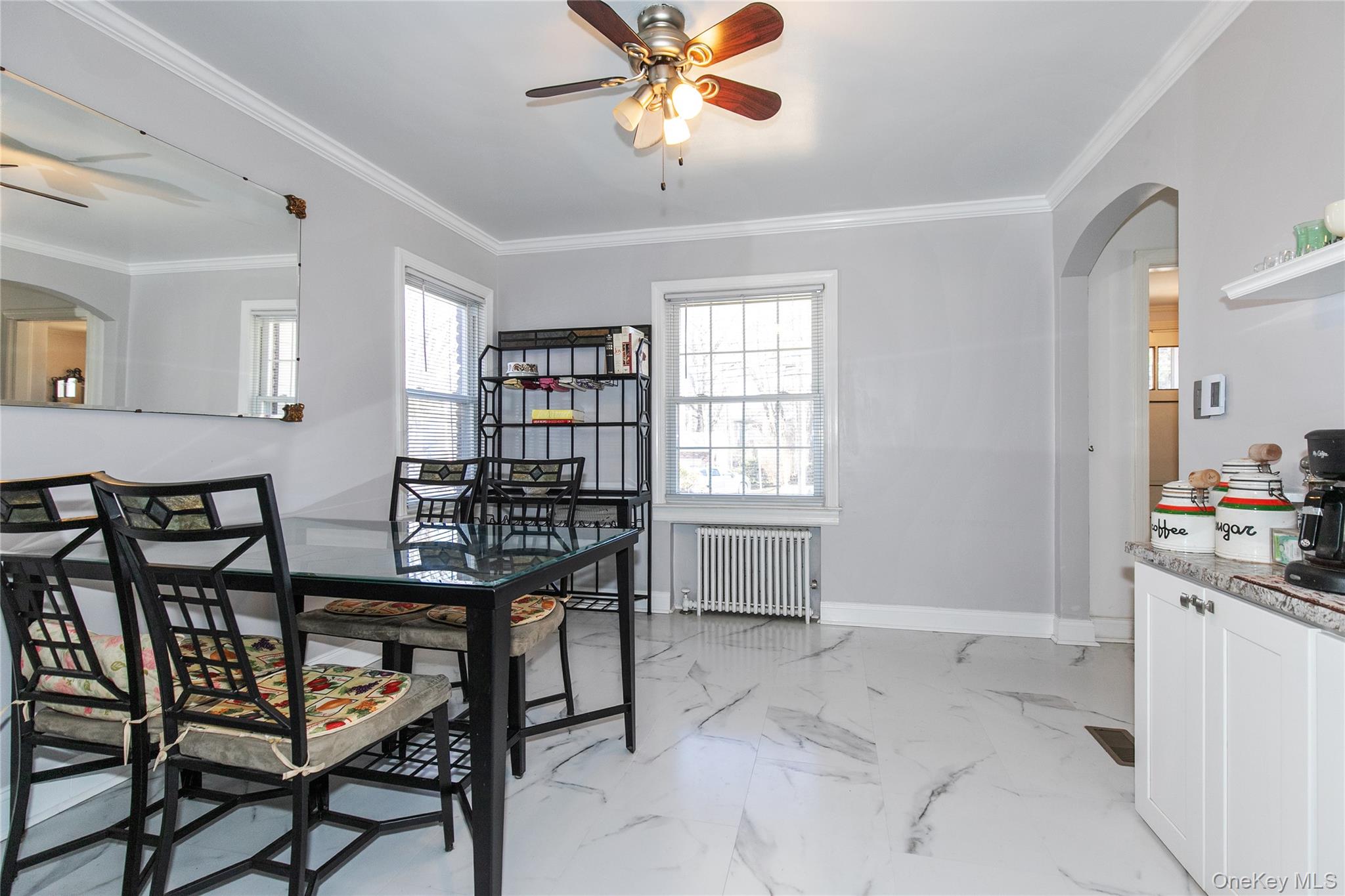 8 Plymouth Road Great Neck, NY 11023 - Photo 9 of 25 a view of a dining room with furniture and window