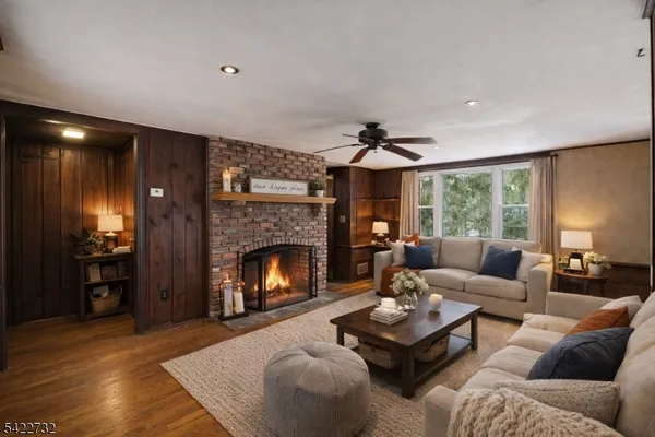 a living room with furniture and a fireplace
