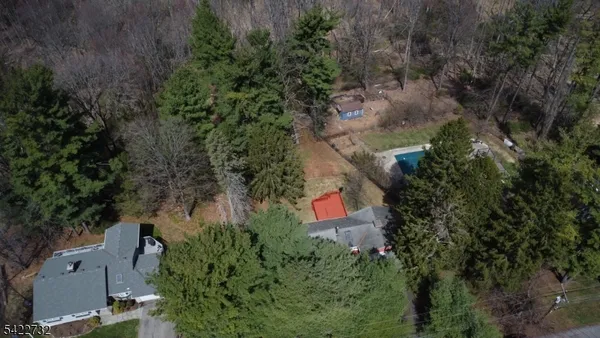 an aerial view of residential house with outdoor and green space