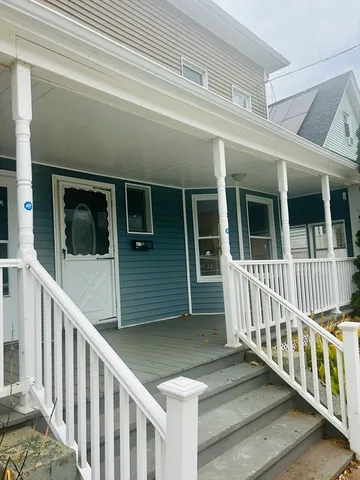 a view of a house with porch and wooden floor