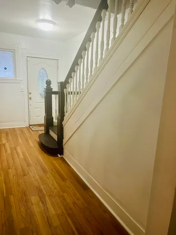 a view of entryway with wooden floor