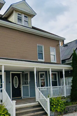 a front view of a house with a porch