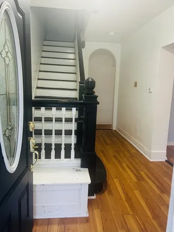 a view of a door of a house with wooden floor