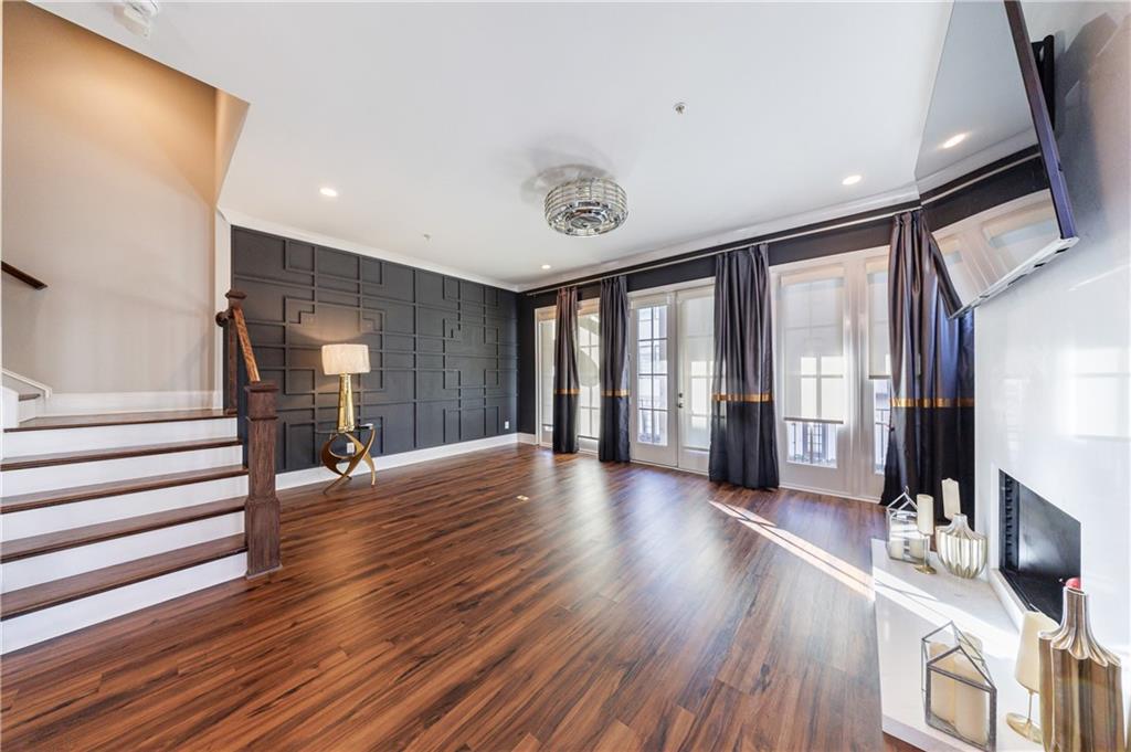2067 Wheaton Way Atlanta, GA 30328 - Photo 11 of 64 a view of an entryway with wooden floor and windows