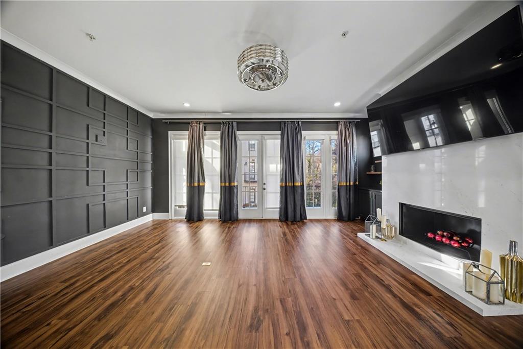 2067 Wheaton Way Atlanta, GA 30328 - Photo 14 of 64 a view of an empty room with a fireplace and a window