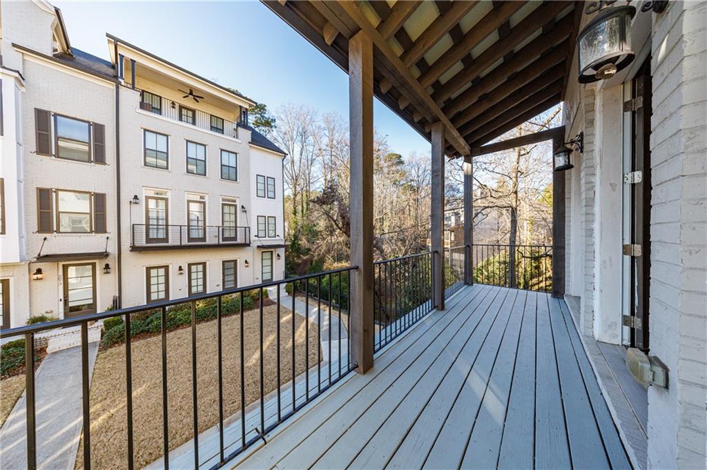 2067 Wheaton Way Atlanta, GA 30328 - Photo 19 of 64 a view of a balcony with wooden floor