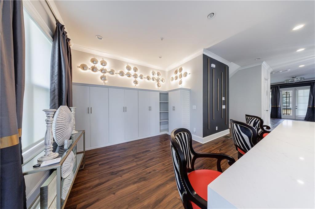 2067 Wheaton Way Atlanta, GA 30328 - Photo 30 of 64 a view of a dining room with furniture and chandelier
