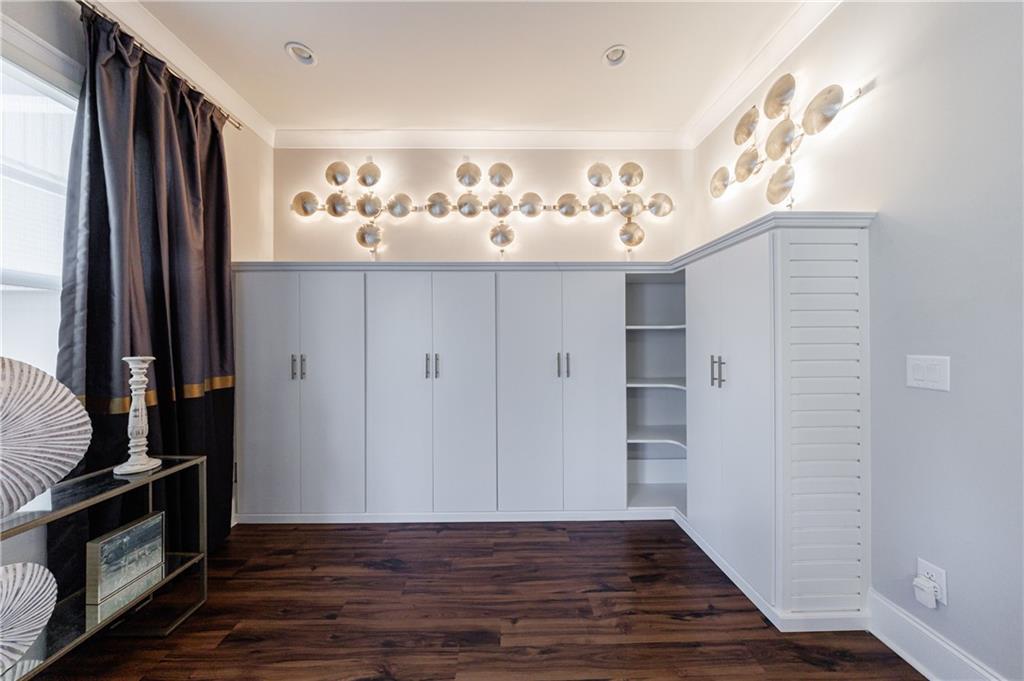 2067 Wheaton Way Atlanta, GA 30328 - Photo 31 of 64 a view of a kitchen with wooden floor and a window