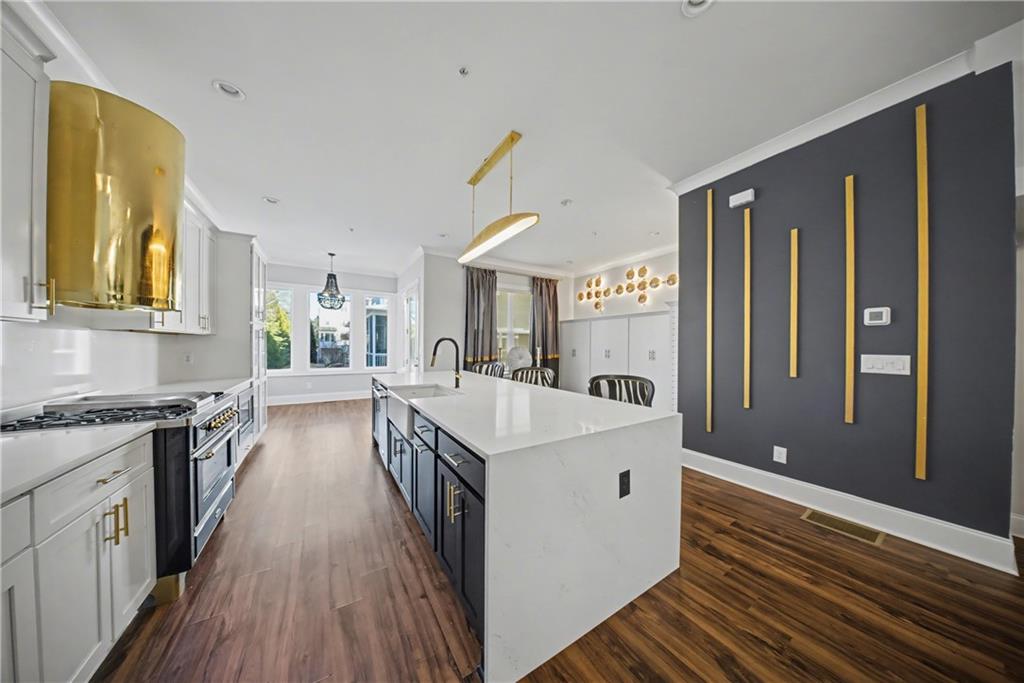 2067 Wheaton Way Atlanta, GA 30328 - Photo 33 of 64 a open kitchen with a sink stove and refrigerator