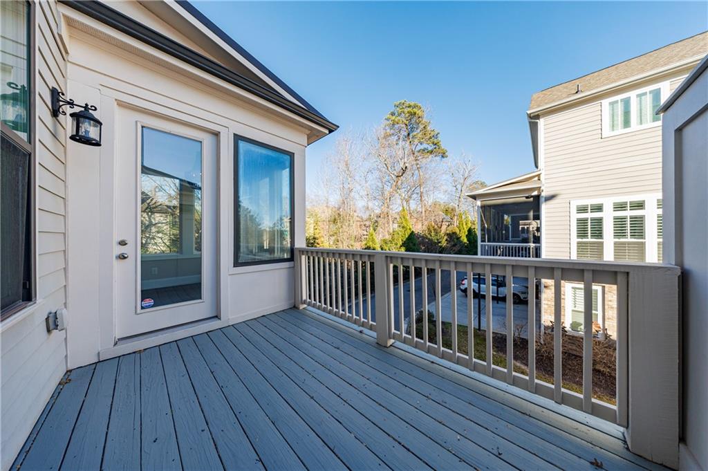 2067 Wheaton Way Atlanta, GA 30328 - Photo 37 of 64 a view of a balcony with wooden floor