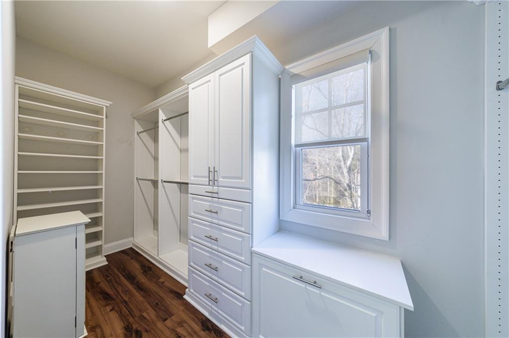 2067 Wheaton Way Atlanta, GA 30328 - Photo 40 of 64 a view of walk in closet with empty racks