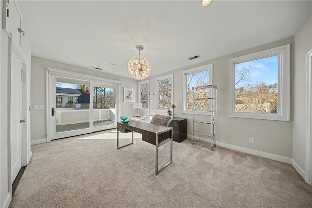 2067 Wheaton Way Atlanta, GA 30328 - Photo 51 of 64 a living room with furniture and a window