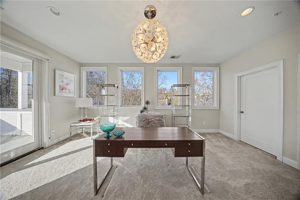 2067 Wheaton Way Atlanta, GA 30328 - Photo 52 of 64 a living room with furniture and a large window