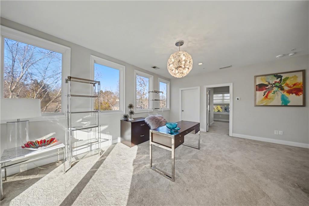 2067 Wheaton Way Atlanta, GA 30328 - Photo 53 of 64 a living room with couches and painting on the wall
