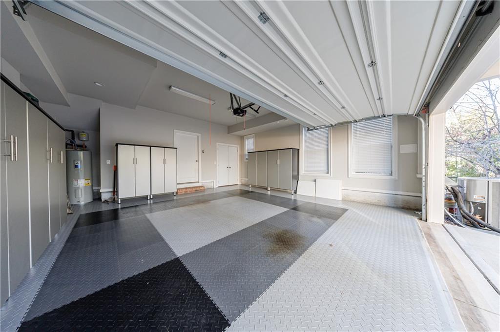 2067 Wheaton Way Atlanta, GA 30328 - Photo 58 of 64 a view of a hall with wooden floor and staircase